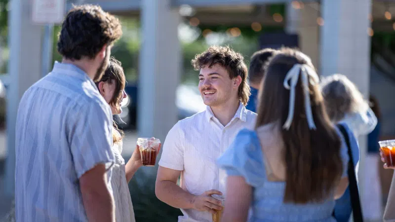 People talking outdoors at the church