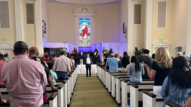 Congregation standing inside the sanctuary