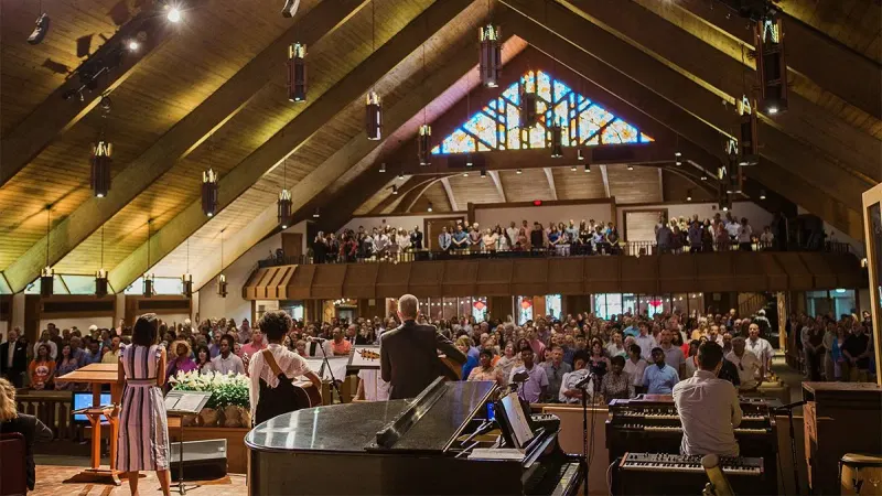 Congregation in a sanctuary with a timber roof