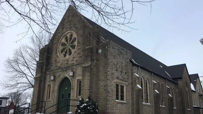 Stone church exterior with arched entrance
